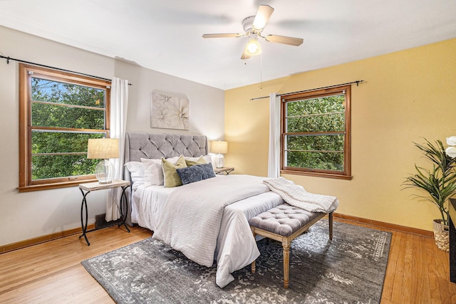 135 Barton Dr, Ann Arbor, MI 48105 - bedroom with wood finished floors, baseboards, and a ceiling fan