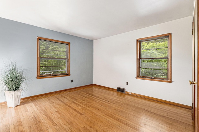 135 Barton Dr, Ann Arbor, MI 48105 - unfurnished room with light wood-type flooring and baseboards