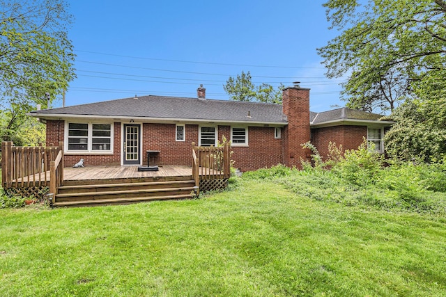135 Barton Dr, Ann Arbor, MI 48105 - rear view of house featuring brick siding, a chimney, and a lawn