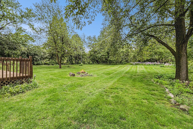 135 Barton Dr, Ann Arbor, MI 48105 - view of grassy yard with a wooden deck