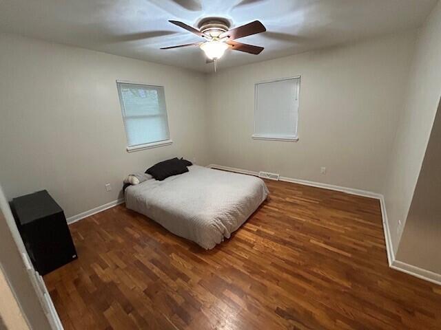 538 Monterey Dr, Benton Harbor, MI 49022 - bedroom featuring wood finished floors, baseboards, and ceiling fan