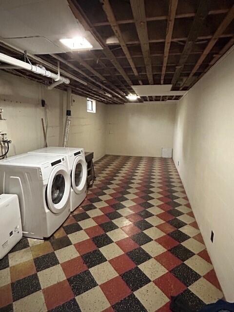 538 Monterey Dr, Benton Harbor, MI 49022 - washroom featuring washing machine and clothes dryer and tile patterned floors