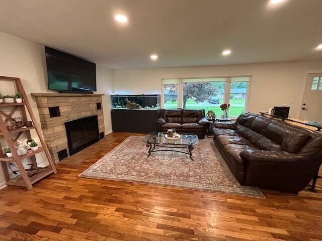 538 Monterey Dr, Benton Harbor, MI 49022 - living room with recessed lighting, wood finished floors, and a stone fireplace