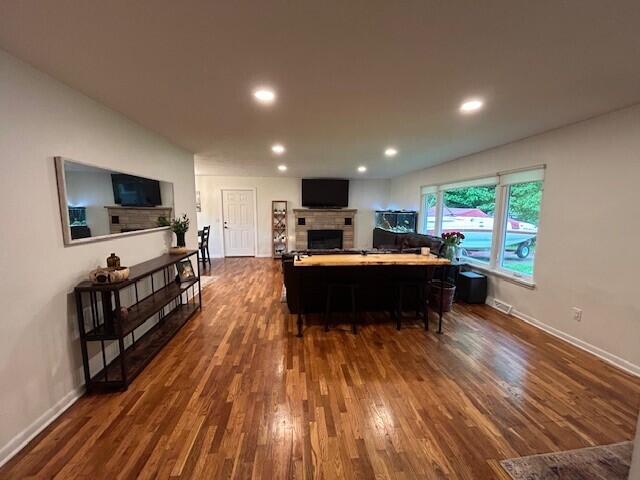 538 Monterey Dr, Benton Harbor, MI 49022 - living room featuring a fireplace, dark wood-style floors, recessed lighting, and baseboards
