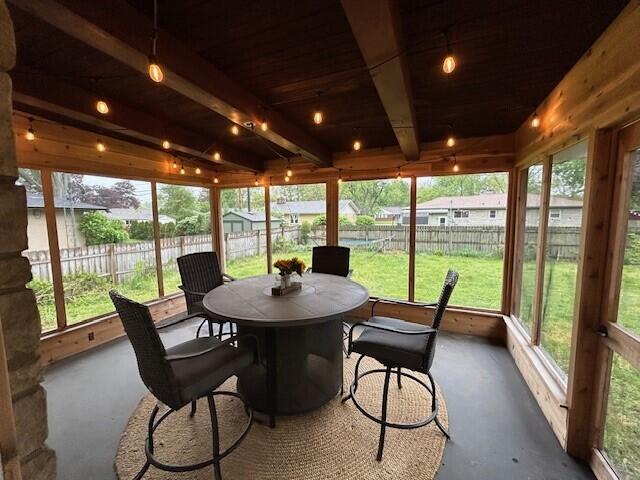 538 Monterey Dr, Benton Harbor, MI 49022 - sunroom with concrete flooring and outdoor dining space