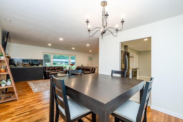 538 Monterey Dr, Benton Harbor, MI 49022 - dining area with light wood-type flooring, a chandelier, and recessed lighting
