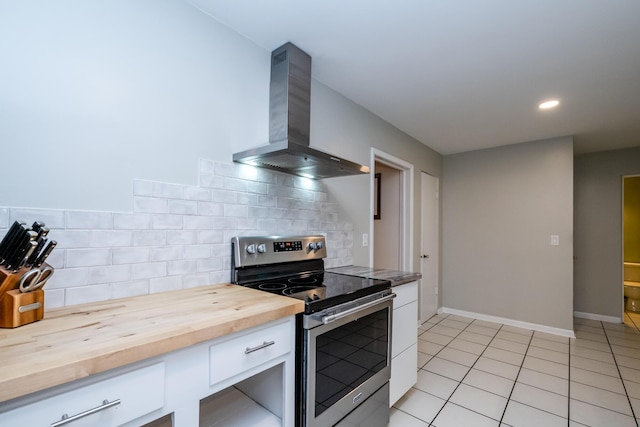 538 Monterey Dr, Benton Harbor, MI 49022 - kitchen featuring electric stove, wall chimney exhaust hood, wood counters, white cabinets, and backsplash