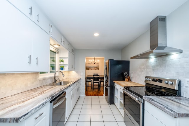 538 Monterey Dr, Benton Harbor, MI 49022 - kitchen featuring wall chimney range hood, stainless steel appliances, a sink, decorative backsplash, and recessed lighting