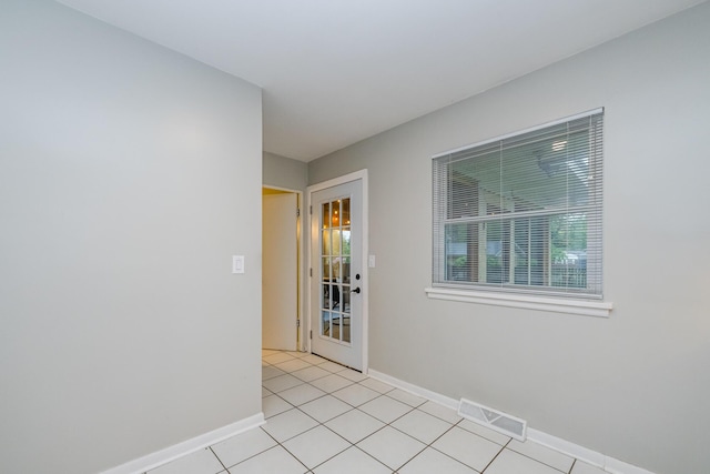 538 Monterey Dr, Benton Harbor, MI 49022 - spare room with plenty of natural light, light tile patterned floors, and baseboards