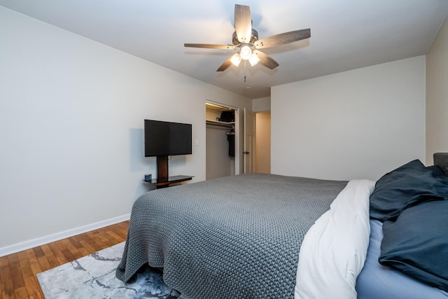 538 Monterey Dr, Benton Harbor, MI 49022 - bedroom featuring wood finished floors, baseboards, a closet, and ceiling fan
