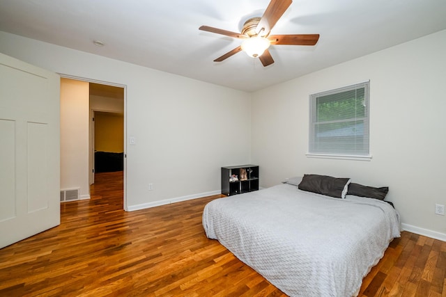 538 Monterey Dr, Benton Harbor, MI 49022 - bedroom with wood finished floors, baseboards, and ceiling fan