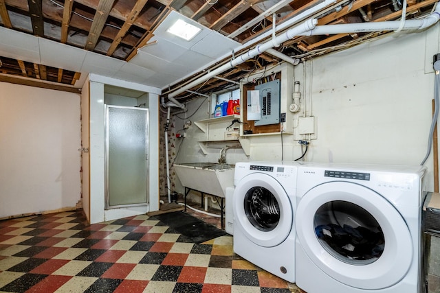 538 Monterey Dr, Benton Harbor, MI 49022 - laundry room featuring electric panel, washing machine and dryer, and tile patterned floors