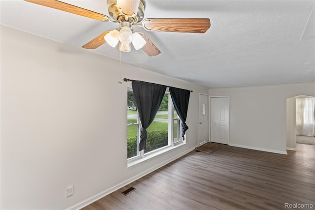 30542 Bretton St, Livonia, MI 48152 - unfurnished room with baseboards, wood finished floors, ceiling fan, and a textured ceiling