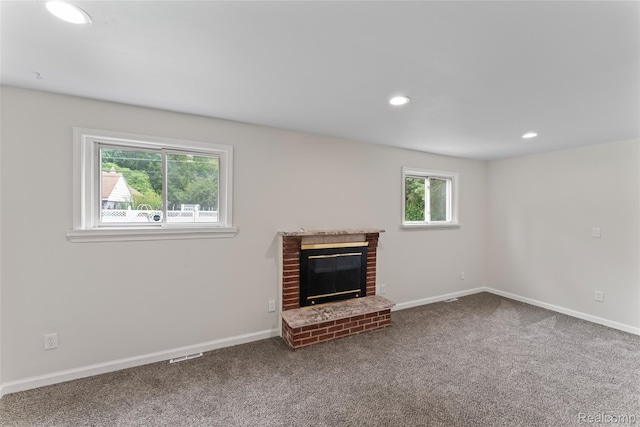 30542 Bretton St, Livonia, MI 48152 - unfurnished living room featuring a brick fireplace, carpet flooring, baseboards, and recessed lighting