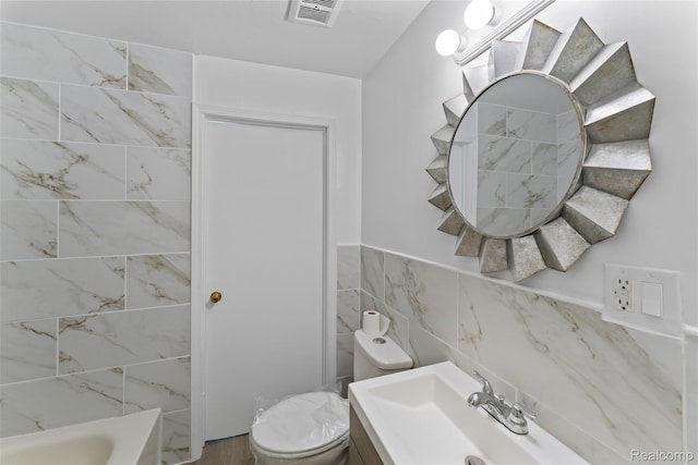 30542 Bretton St, Livonia, MI 48152 - bathroom featuring toilet, vanity, and tile walls