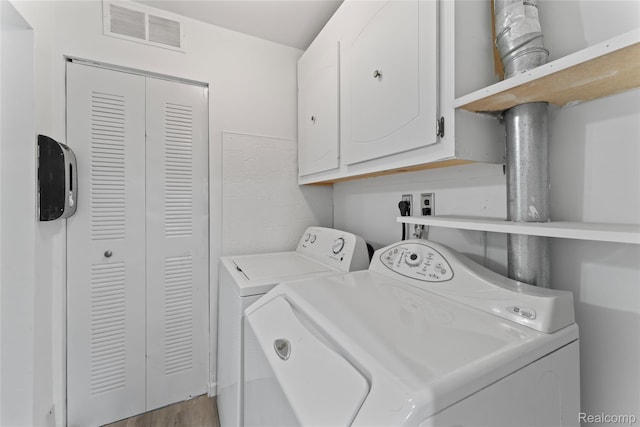 30542 Bretton St, Livonia, MI 48152 - washroom with separate washer and dryer and cabinet space