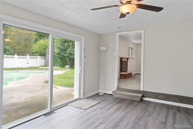 30542 Bretton St, Livonia, MI 48152 - unfurnished room featuring a ceiling fan, baseboards, wood finished floors, and a textured ceiling