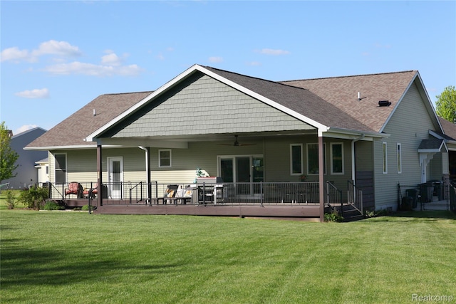 1041 Lancaster St, Lapeer, MI 48446 - rear view of property with ceiling fan, a yard, a deck, and a shingled roof