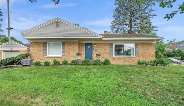 1155 Cadillac Dr SE, Grand Rapids, MI 49506 - ranch-style house featuring central air condition unit, brick siding, a front lawn, and a chimney
