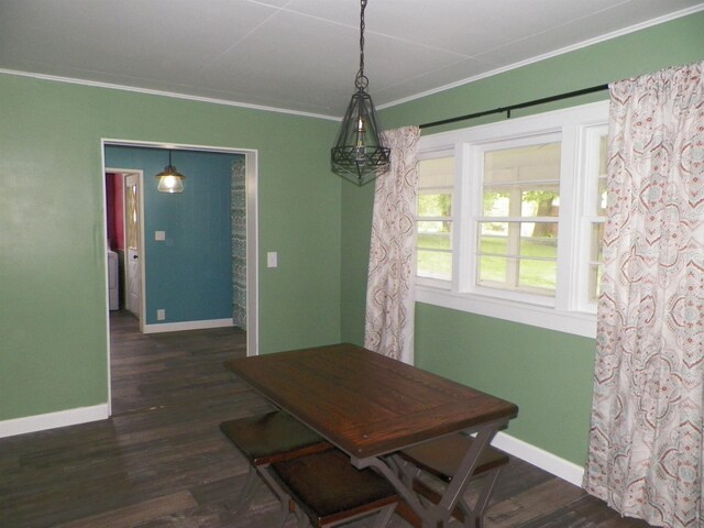 213 Cass St, Tustin, MI 49688 - dining area with crown molding, baseboards, and dark wood finished floors