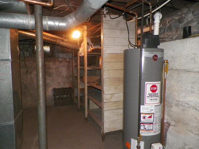 213 Cass St, Tustin, MI 49688 - unfinished basement with gas water heater