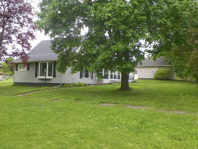 213 Cass St, Tustin, MI 49688 - view of front of house with a front yard
