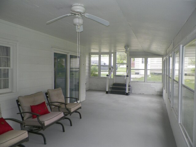 213 Cass St, Tustin, MI 49688 - sunroom / solarium with ceiling fan, vaulted ceiling, and concrete flooring