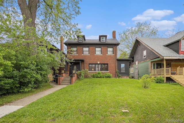 2223 S La Salle Gdns, Detroit, MI 48206 - view of front of property with a chimney, a front yard, and brick siding
