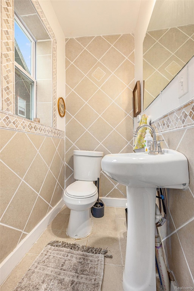 2223 S La Salle Gdns, Detroit, MI 48206 - bathroom with tile walls, tile patterned flooring, toilet, and a sink