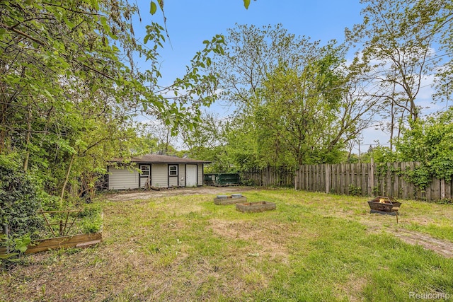 2223 S La Salle Gdns, Detroit, MI 48206 - view of yard with a fire pit, a vegetable garden, and an outdoor structure