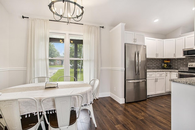 830 E Lyons St, Schoolcraft, MI 49087 - kitchen featuring stainless steel appliances, a chandelier, decorative backsplash, white cabinetry, and recessed lighting