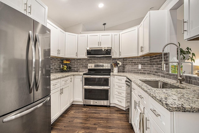 830 E Lyons St, Schoolcraft, MI 49087 - kitchen with stainless steel appliances, a sink, dark wood-style flooring, backsplash, and white cabinets