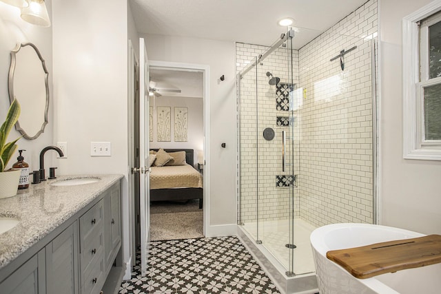 830 E Lyons St, Schoolcraft, MI 49087 - ensuite bathroom with tile patterned floors, a stall shower, double vanity, a bath, and ceiling fan