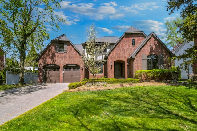 1655 Dorchester Rd, Birmingham, MI 48009 - tudor-style house with brick siding and driveway