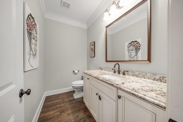 1655 Dorchester Rd, Birmingham, MI 48009 - half bath with vanity, wood finished floors, toilet, crown molding, and baseboards
