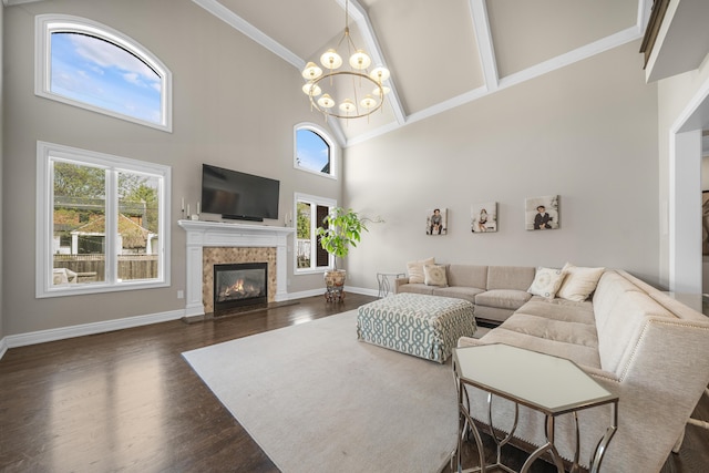 1655 Dorchester Rd, Birmingham, MI 48009 - living room with high vaulted ceiling, a chandelier, dark wood-style floors, a premium fireplace, and baseboards