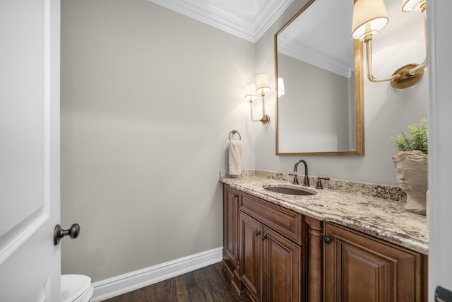 1655 Dorchester Rd, Birmingham, MI 48009 - bathroom featuring crown molding, vanity, baseboards, wood finished floors, and toilet