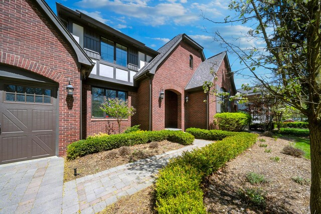 1655 Dorchester Rd, Birmingham, MI 48009 - tudor home with brick siding and a shingled roof