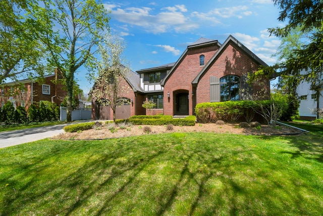 1655 Dorchester Rd, Birmingham, MI 48009 - tudor house featuring brick siding and driveway