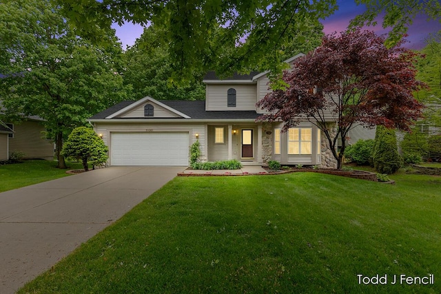 11081 Timberline Dr, Allendale, MI 49401 - view of front of property with a garage, a front lawn, concrete driveway, and stone siding