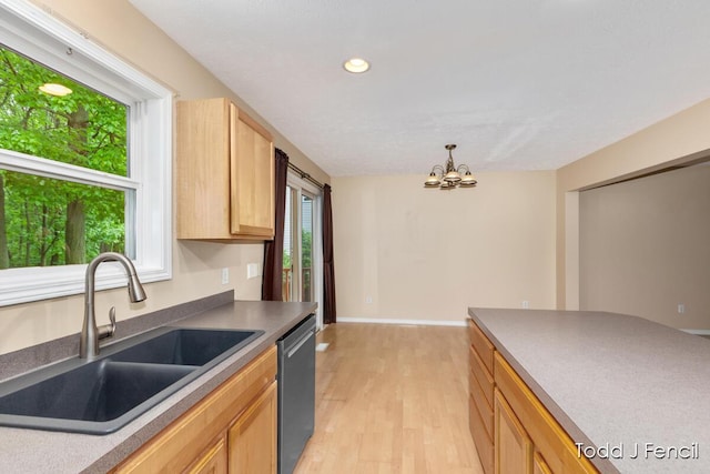 11081 Timberline Dr, Allendale, MI 49401 - kitchen with a sink, stainless steel dishwasher, light wood-type flooring, a chandelier, and recessed lighting