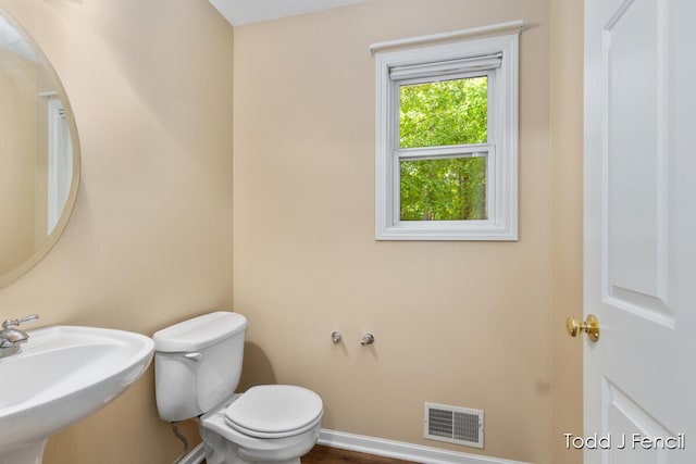 11081 Timberline Dr, Allendale, MI 49401 - bathroom with a sink, toilet, and baseboards