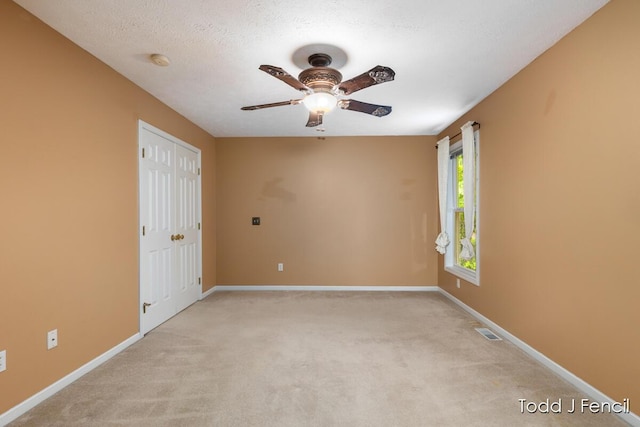 11081 Timberline Dr, Allendale, MI 49401 - spare room with a ceiling fan, light colored carpet, baseboards, and a smoke detector