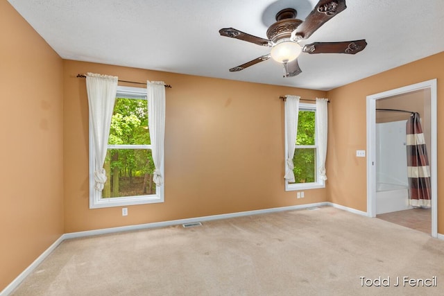 11081 Timberline Dr, Allendale, MI 49401 - carpeted spare room with baseboards and a ceiling fan