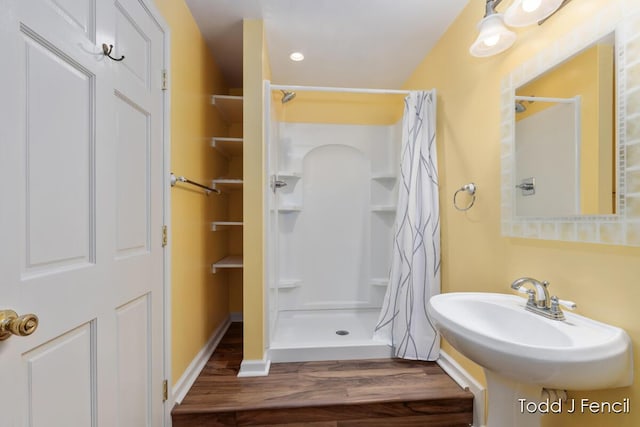 11081 Timberline Dr, Allendale, MI 49401 - full bath with wood finished floors and a stall shower