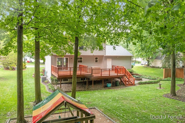 11081 Timberline Dr, Allendale, MI 49401 - back of house with a deck, a yard, and stairs