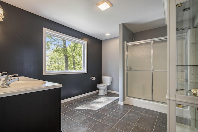 15842 Portage Rd, Vicksburg, MI 49097 - bathroom featuring tile patterned flooring, a stall shower, vanity, and toilet