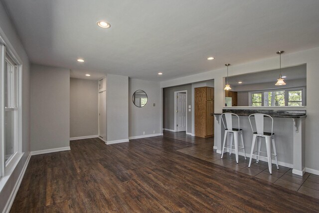 15842 Portage Rd, Vicksburg, MI 49097 - living room featuring dark wood-type flooring, recessed lighting, and baseboards