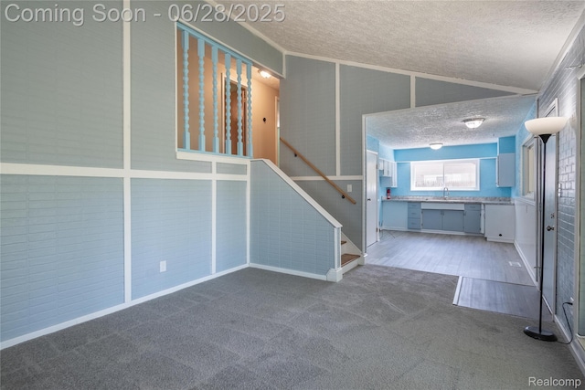 36426 Weideman St, Clinton Township, MI 48035 - foyer entrance featuring a textured ceiling, carpet flooring, stairway, and lofted ceiling
