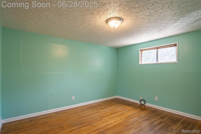 36426 Weideman St, Clinton Township, MI 48035 - unfurnished room featuring wood finished floors and a textured ceiling